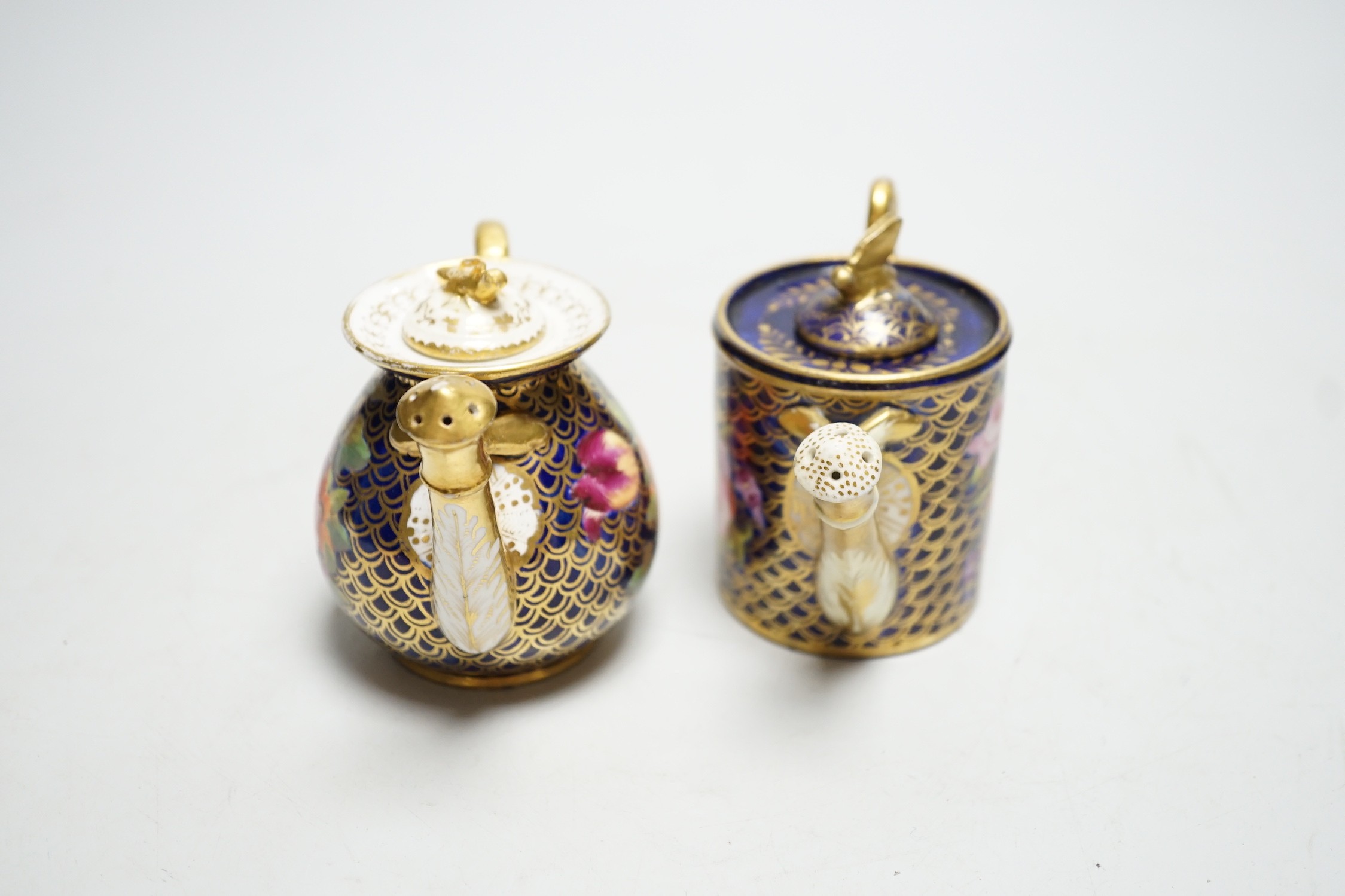 Toy porcelain: Two English rosewater scale ground sprinklers, c.1815-20, possibly Coalport, each modelled in the form of a watering can